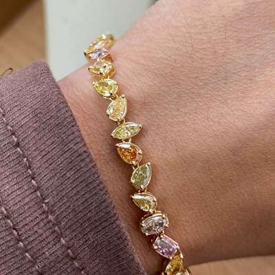 A stunning mix color mix fancy shape diamond bracelet in 18k gold