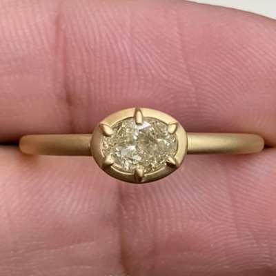 0.65ct natural light yellow colour Oval Diamond set in 18 k matte finish gold Ring