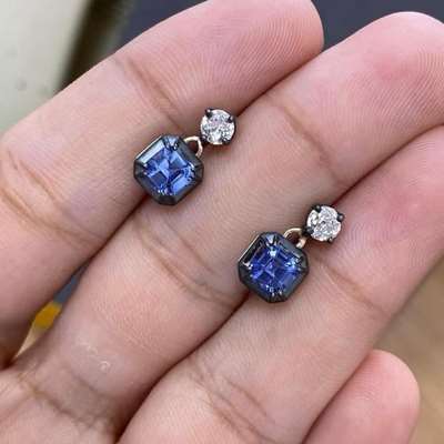earring is set with an old cut white diamond and a rich deep blue sapphire.