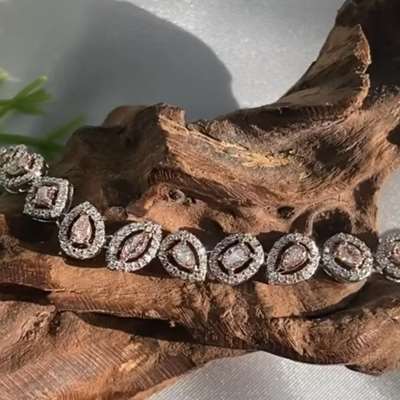 natural pear shape brownish pink diamond tennis bracelet in 18k gold