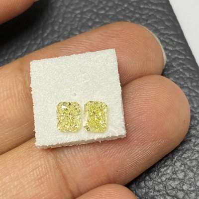 1.16ct total weight matching pair of radiant cut natural fancy light yellow vs2-si1 + 18k double halo setting 