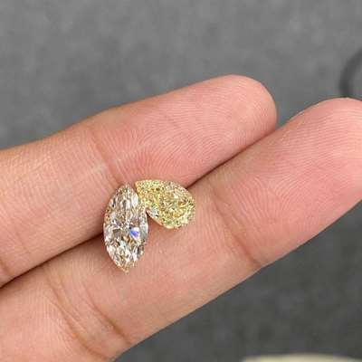 1.53ct no certificate M color faint brown VS1 clarity marquise along with 1.52ct GIA certified natural fancy light yellow VVS2 clarity pear shape diamond layout