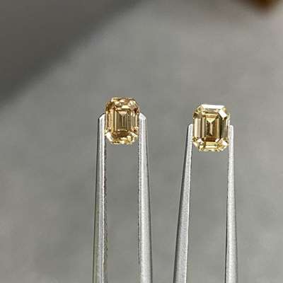 1.01ct total weight matching pair of natural fancy champagne brown SI clarity emerald cut diamonds 