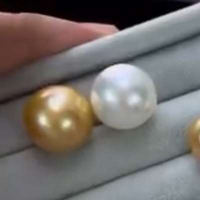 Matching pair of 14mm natural south sea pearl gold and silver