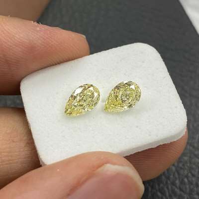 0.66ct & 0.69ct GIA Certified Matching Pair Of Natural Fancy Light Yellow VS1 & SI1 Clarity Pear Shape Diamonds