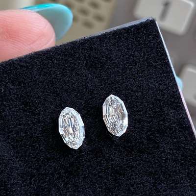 0.63cts Pair of Natural i color VS2 clarity step cut oval shape diamonds