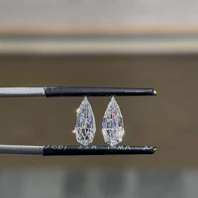 0.57ct and 0.52ct gia certified natural d vs2 & d vs1 step cut pear diamond pair set in 18k gold earings