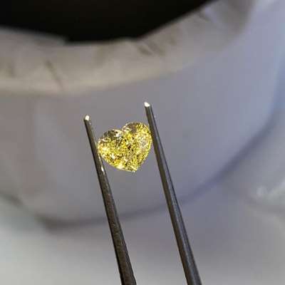 0.81ct Natural Fancy Yellow Heart Shape Diamond, featuring SI1 clarity. 