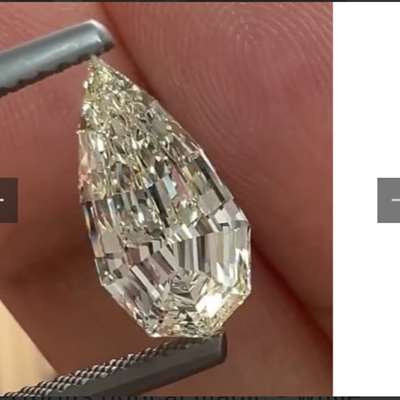 Pale yellow step cut pear shape diamond