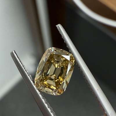 Adorn yourself with this stunning 1.34ct greenish yellowish brown VS1 clarity old cut cushion shape diamond