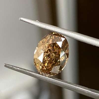  3.02ct Natural Brown Diamond. This stunning gemstone boasts an oval shape and VS2 clarity, 