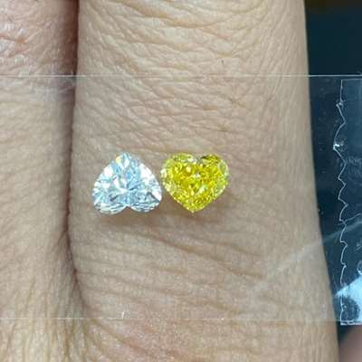 0.62ct GIA Certified Natural Fancy Vivid Yellow VVS1 Clarity Heart Shape Diamond Along With 0.46ct GIA Certified Natural F Color VVS2 Clarity Heart Shape Diamond