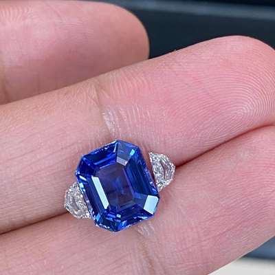 5.28ct GIA Certified Natural Ceylon (Srilanka) Blue Sapphire Heated Emerald Shape Gemstone Along With 0.45ct Total Weight Matching Pair Of Natural FG Color VVS-VS Clarity Cadillac Shape Diamonds For 3 stone ring layout.