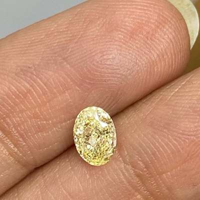 0.63cts Natural fancy light yellow vs1 clarity oval shape diamond