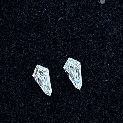 0.26cts total weight pair of Natural fg color vs2 clarity kite shape diamonds