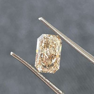 1.00cts GIA Certified natural W-X range, light brown color VVS1 clarity Radiant shape diamond. 