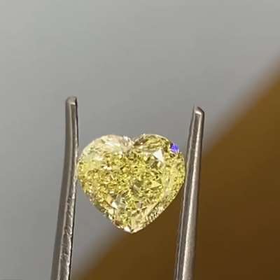 1.01-carat GIA certified Natural Fancy Yellow diamond features a captivating heart shape and VS2 clarity