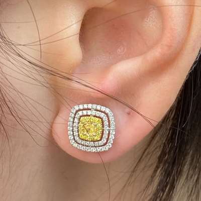 0.32ct total weight Matching pair of natural Fancy Yellow cushion diamonds set in 18 k gold earrings