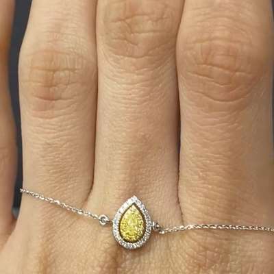 0.12ct Natural Fancy Light Yellow Pear diamond set in 18 K gold bracelet