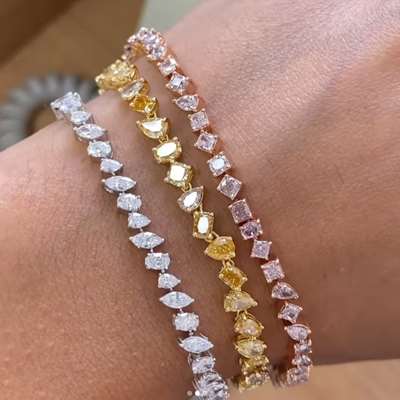 Mix color tennis bracelet A beautiful mix fancy color vs-si clarity mix fancy shape diamond bracelet in 18k yellow gold