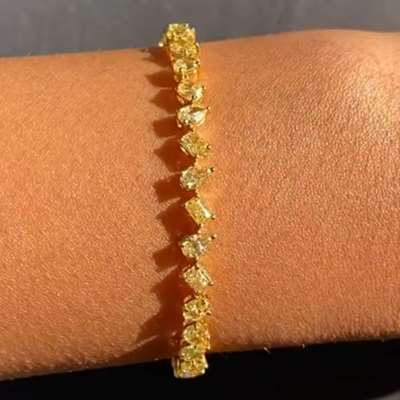 Natural Fancy Yellow Mix Shape Tennis Bracelet in 18k Yellow Gold.