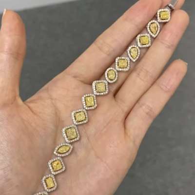 18k Gold Mix Shape Fancy Yellow Diamond Tennis Bracelet with Floating White Diamond Halo