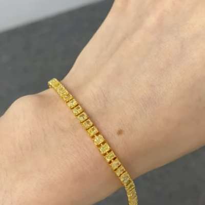 Natural Radiant Cut Yellow Diamond Tennis Bracelet in 18k Yellow Gold.