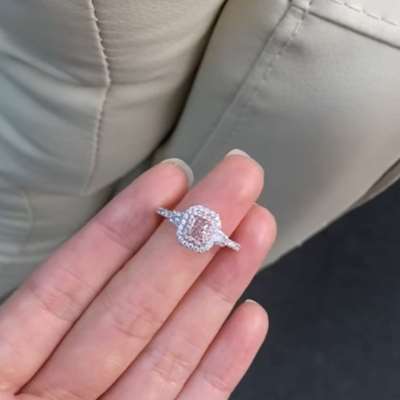 Centered with a GIA Certified 0.32ct in Fancy Brown Pink, Vs1 clarity, Radiant Shape.