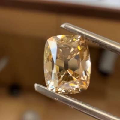 A 1.33ct natural brown VS2 long old cut cushion that feels bold the moment you see it.