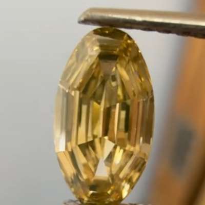 A 1.02ct natural yellowish brown step cut oval with VS2 clarity, cut so clean and precise that the light feels almost hypnotic.