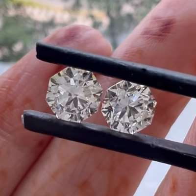 A 0.71ct & 0.70ct GIA certified natural L color VS1 & VVS2 clarity octagon shape diamond pair.