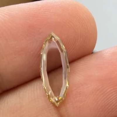 A 1.12cts VS1 marquise portrait cut diamond in the most extraordinary brownish greenish yellow tone.