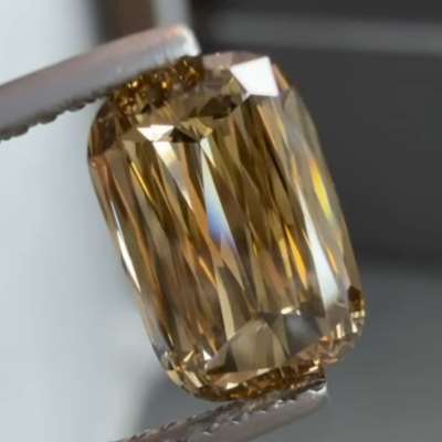 A 2.12ct GIA Natural Fancy Yellowish Brown SI1 Elongated Scissor Cut Diamond.