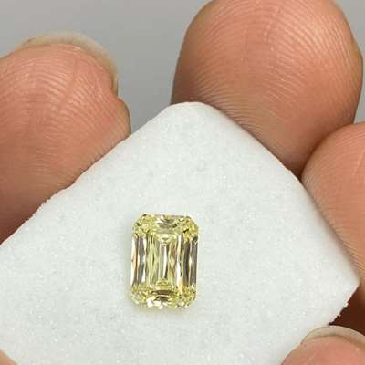0.90cts GIA certified Natural Fancy light yellow VS1 clarity scissor cut Radiant shape diamond