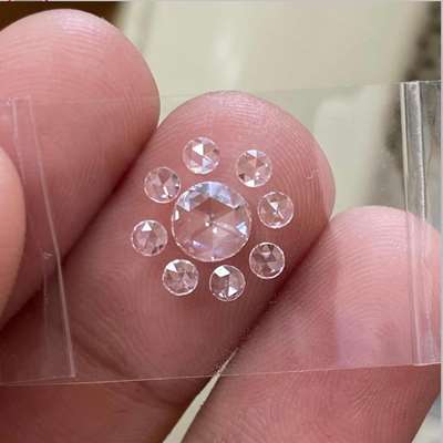 The centre 0.34ct natural F color VS1 rosecut is framed beautifully with eight matching rosecut diamonds totalling 0.23cts, 