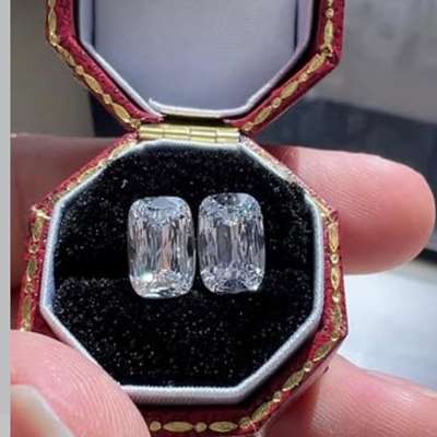 A 1.20ct + 1.20ct GIA-certified D color antique cushion duo that blends vintage cuts with modern radiance.
