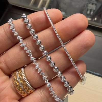 Natural IGI Certified white round diamond bubble tennis bracelet in 18k white gold