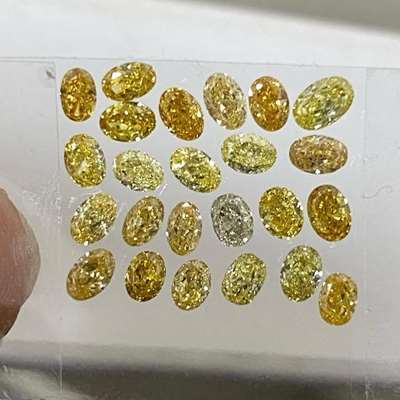 3.98 carats. 24 natural oval diamonds. Each one carrying its own shade of yellow 