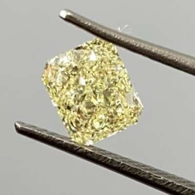 1.09 carat single piece modified radiant cut diamond, glowing in a warm W-X yellow vvs2 clarity