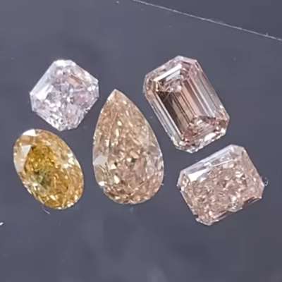 2.13cts of natural pinkish brown, peachy brown, orangy brown, and brownish pink diamonds, with VS1 clarity and oval, emerald, pear, and radiant shapes. 