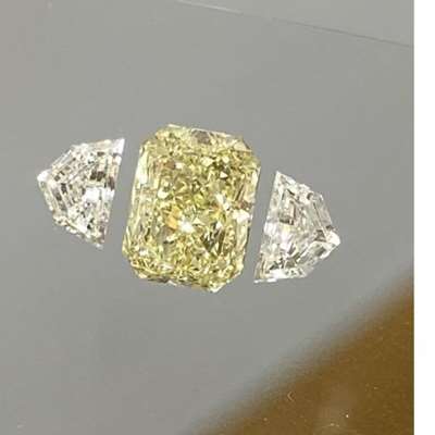 1.01cts GIA certified Natural light yellow (Y-Z range ) VS1 clarity Radiant shape diamond with 0.40cts total weight pair of natural fg color vs clarity Cadillac shape diamonds as shoulder stones