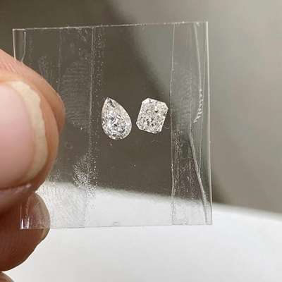 A 0.62ct total weight duo: one a graceful pear shape, the other a bold radiant cut. Both in IJ color, VS clarity 