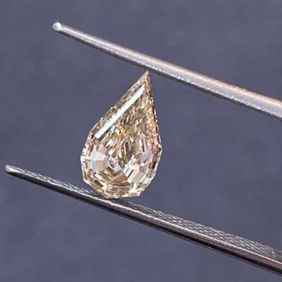 1.13cts Natural peachy brown si1 clarity step cut pear shape diamond