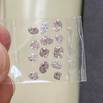 1.54ct layout of 13 natural brownish pink diamonds 