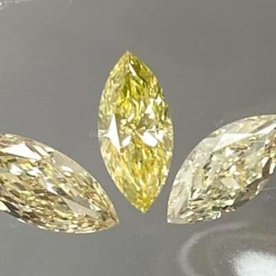  1.47 cts A trio of fancy color marquise diamonds, each with VS clarity and their own quiet intensity