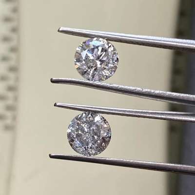 Weighing 1ct and 1.06ct, beautiful pair of natural salt and pepper round brilliant diamonds feels like two tiny galaxies created to be together. 