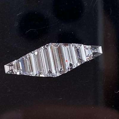  an 8-piece Natural Diamond Layout with a total weight of 0.70cts, featuring stunning Trapezoid shapes in G color, VVS2 clarity.