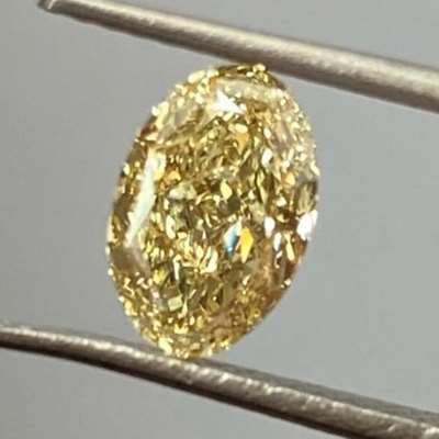 This 1.24ct natural gia fancy brownish yellow oval diamond vvs1 clarity