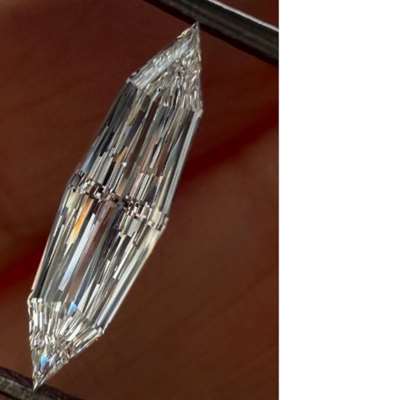 A 0.60ct GIA-certified long step-cut marquise, with E color and VVS1 clarity