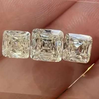The 3 stones are gia certified L color with the center weighing 1.71ct and the sides are 1.01ct & 1.07ct. clarity for the 3 stones are vs1 & vvs1 . scissor cut 